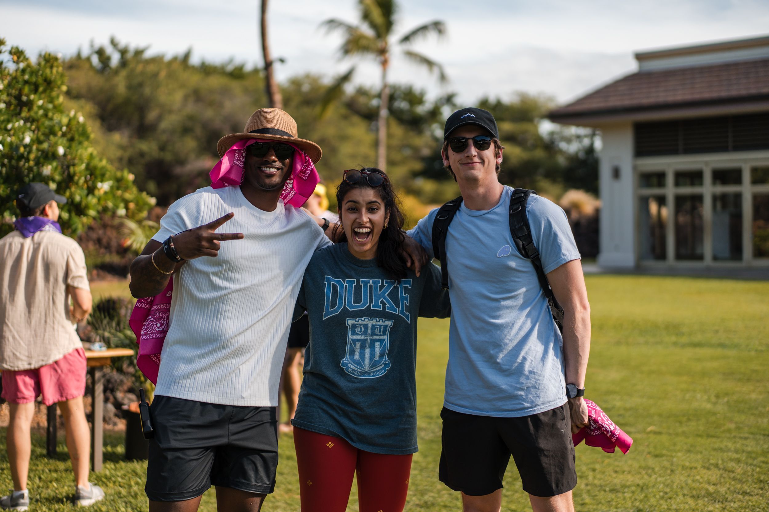a group of people are posing for a picture in a field .