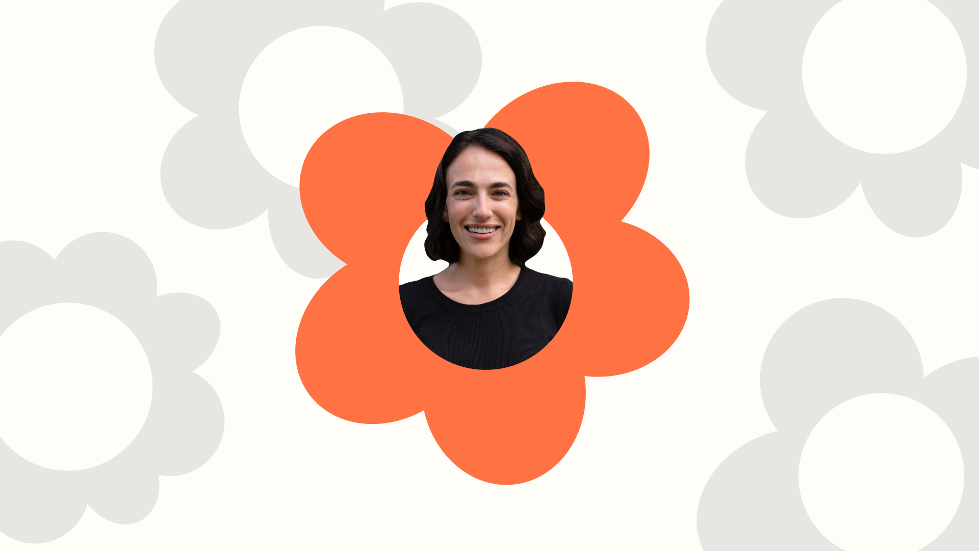 a woman in a black shirt is surrounded by orange flowers