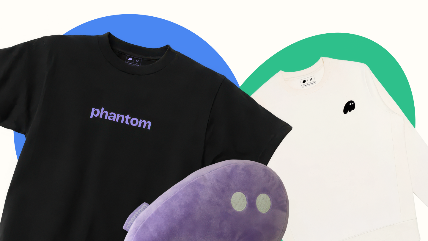 Black t-shirt, white long-sleeve shirt, and purple plush pillow, all featuring Phantom branding.