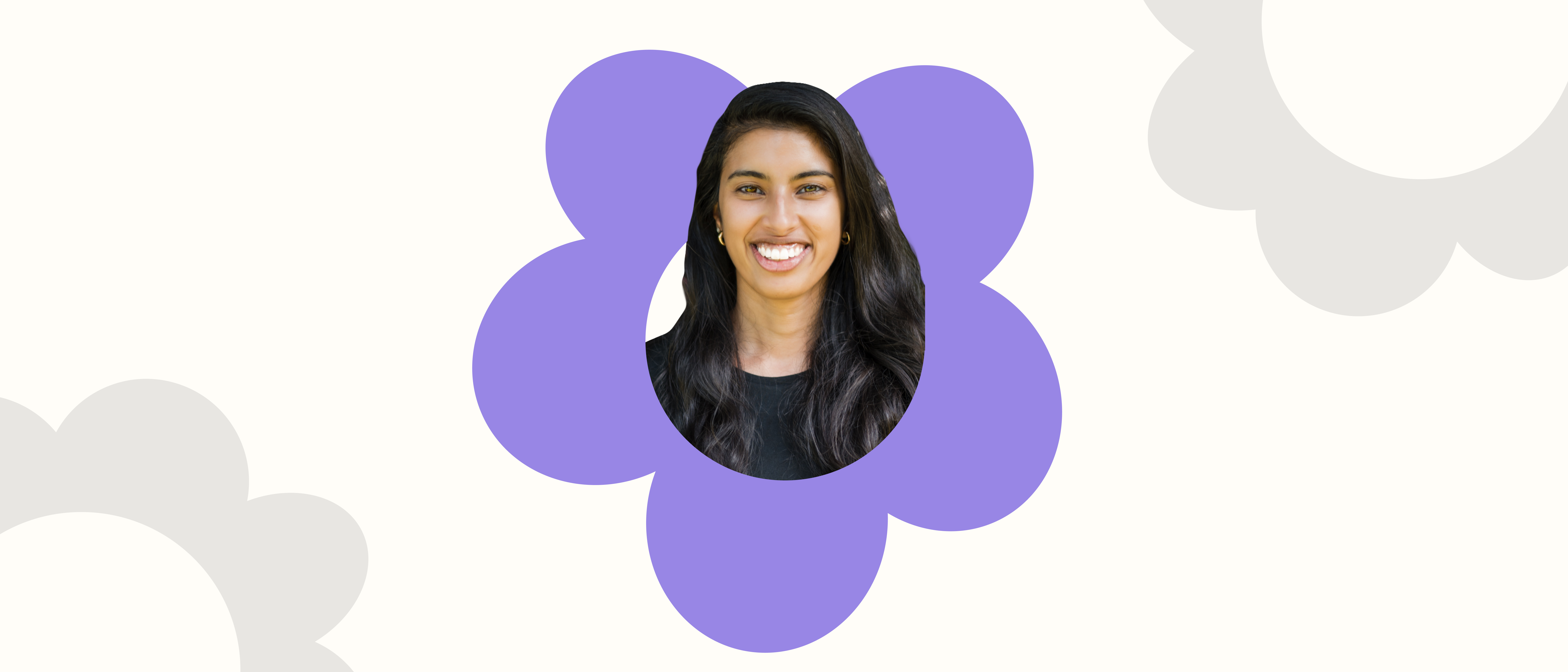 a woman is smiling in a purple flower