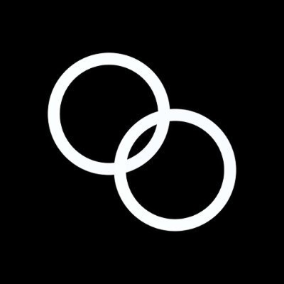 a pair of wedding rings on a black background .